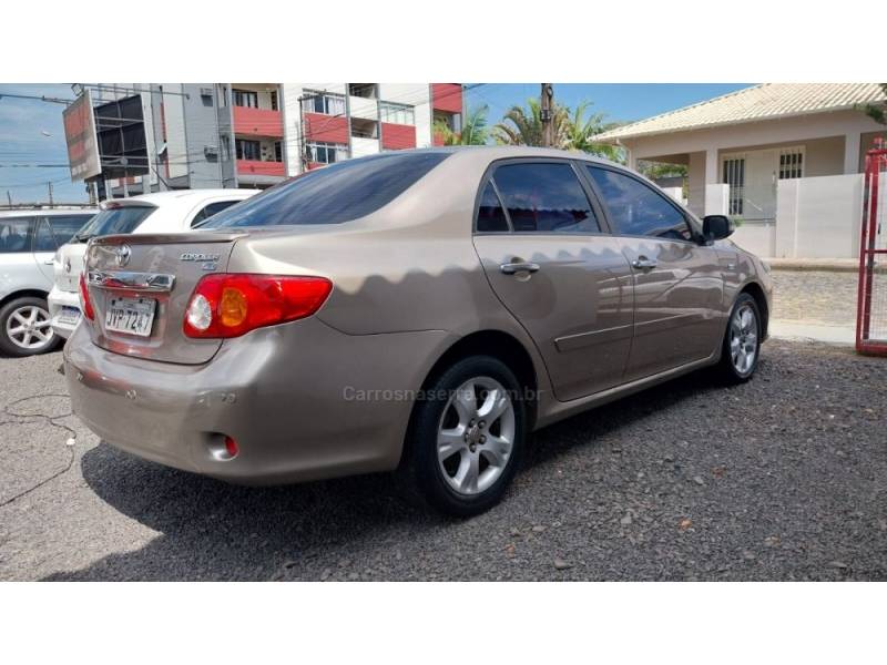 TOYOTA - COROLLA - 2009/2010 - Bege - R$ 56.900,00